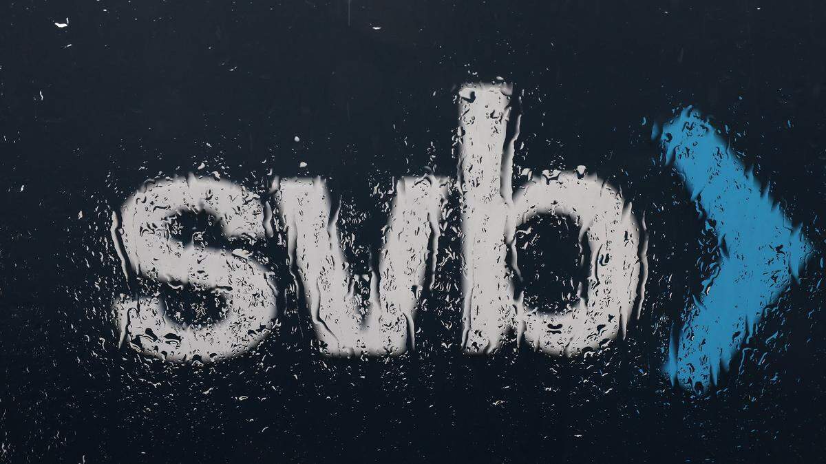 The Silicon Valley Bank logo is seen through a rain covered window in front of the SVB headquarters on March 10, 2023, in Santa Clara, California. (Justin Sullivan/Getty Images/TNS)