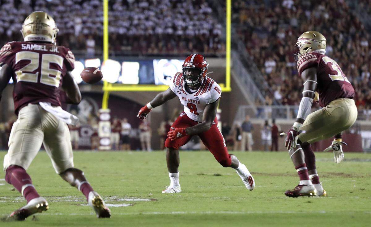 On second and goal, the ball passes by N.C. State’s Ricky Person Jr. (8) after a bad throw during the first half of N.C. State’s game against Florida State at Doak Campbell Stadium in Tallahassee, Fla., Saturday, Sept. 28, 2019.