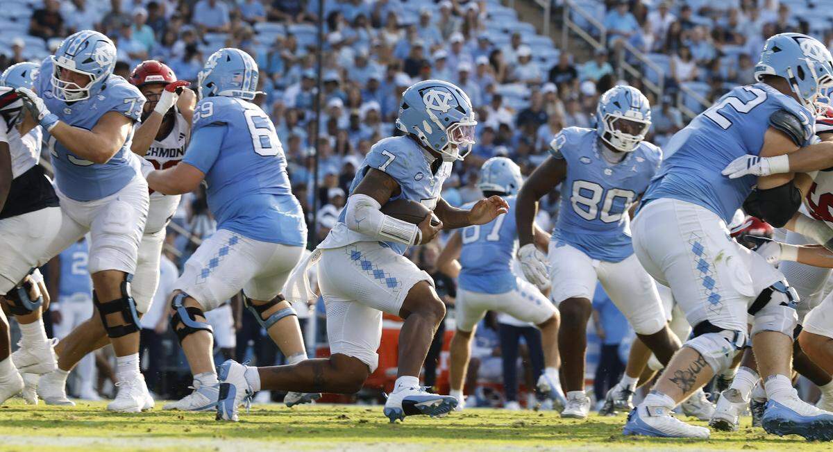 North Carolina quarterback Gio Lopez (7) gains yards during the second half of UNC’s 41-6 victory over Richmond at Kenan Stadium in Chapel Hill, N.C., Saturday, Sept. 13, 2025.
