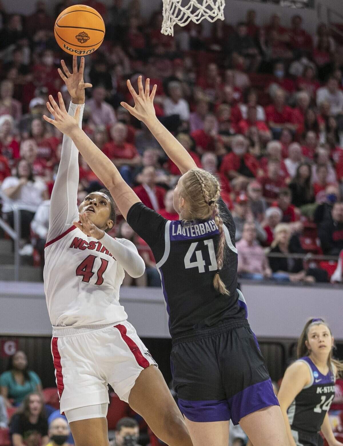 N.C. States Camille Hobby (41) puts up a shot against Kansas States Taylor Lauterbach (41) during first half in the second round of the NCAA Tournament on Monday, March 21, 2022 at Reynolds Coliseum in Raleigh, N.C.