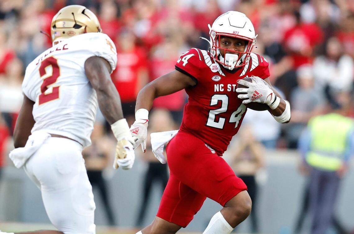 N.C. State running back Michael Allen (24) looks to get by Boston College linebacker Bryce Steele (2) during the first half of N.C. State’s game against Boston College at Carter-Finley Stadium in Raleigh, N.C., Saturday, Nov. 12, 2022.