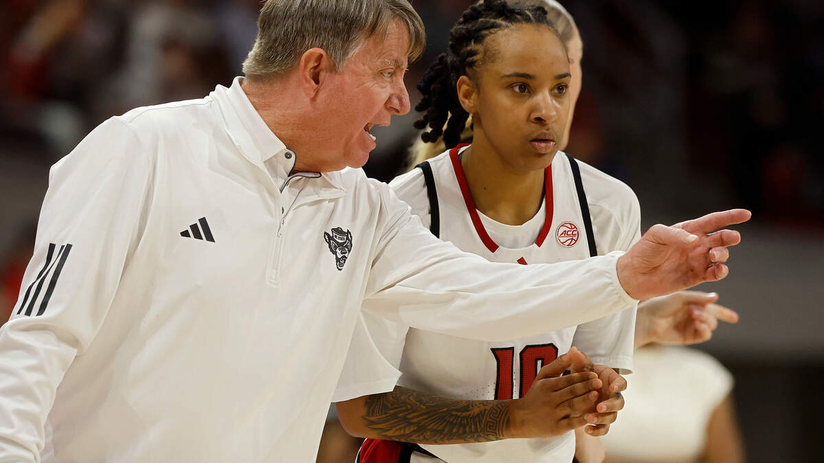 N.C. State head coach Wes Moore speaks with Aziaha James during the second half of the Wolfpack’s 104-95 overtime win over Notre Dame on Sunday, Feb. 23, 2025, at Reynolds Coliseum in Raleigh, N.C.