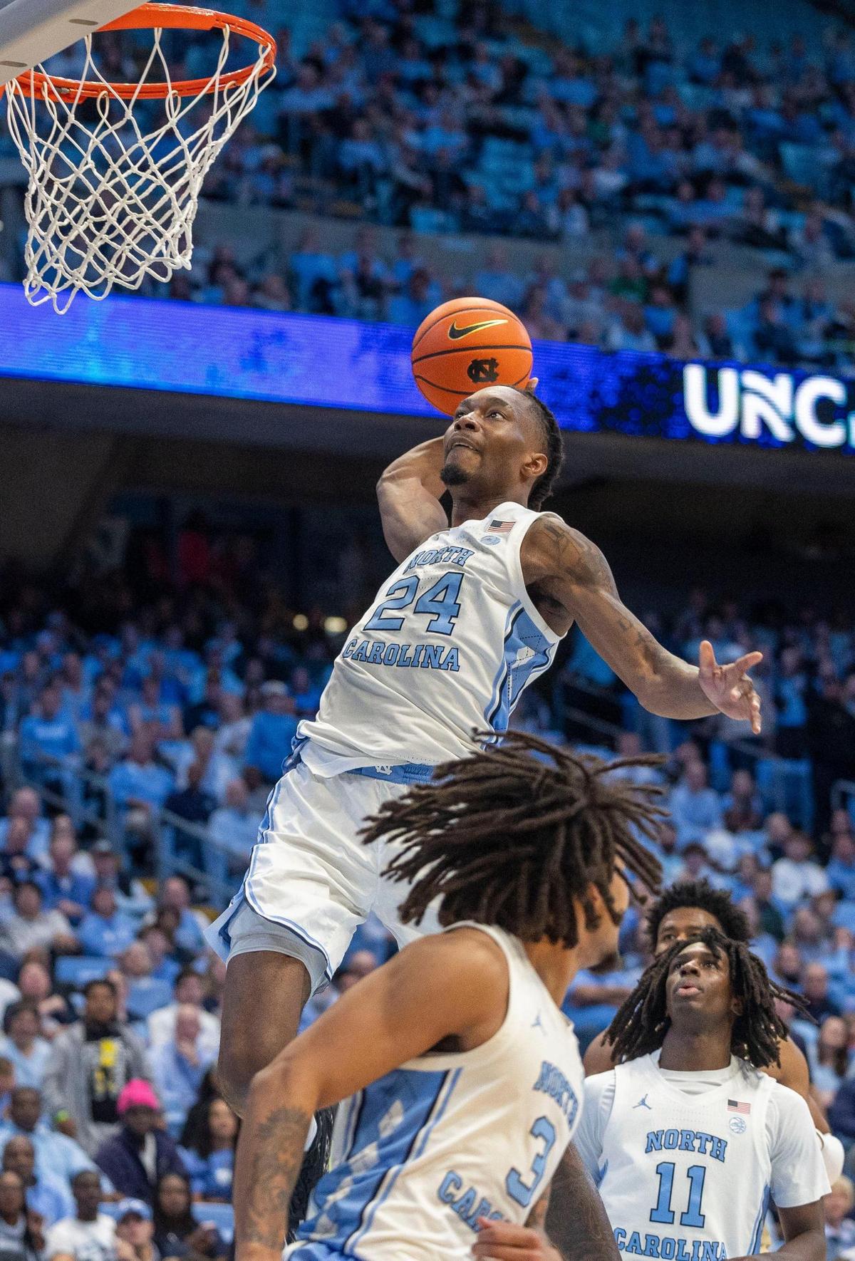 North Carolina forward Jae’Lyn Withers (24) soars to the basket for a dunk in the second half against Georgia Tech on Saturday, December 7, 2024 at the Smith Center in Chapel Hill, N.C.