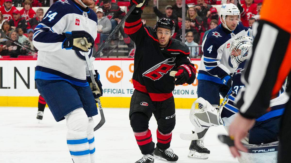 Carolina Hurricanes center Logan Stankoven (22) scores a goal against the Winnipeg Jets during the third period at Lenovo Center.