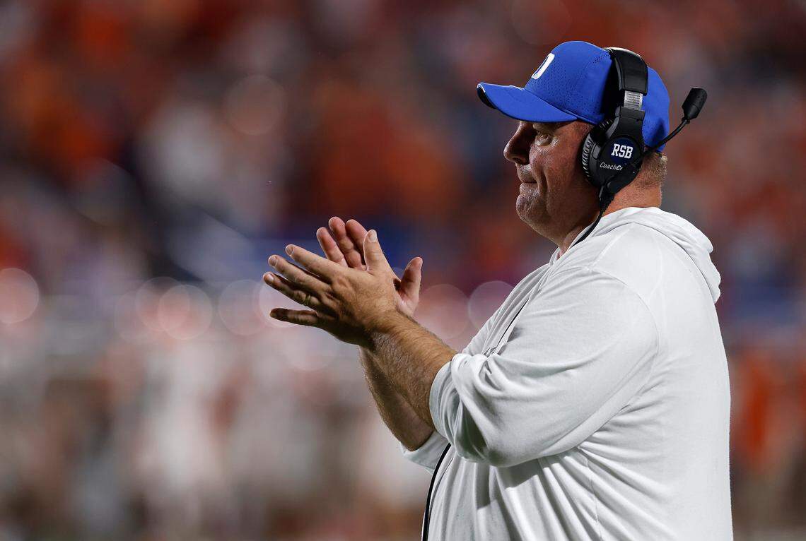 Duke head coach Mike Elko applauds his team during the first half of the Blue Devils’ season opening game against Clemson on Monday, Sept. 4, 2023, at Wallace Wade Stadium in Durham, N.C.