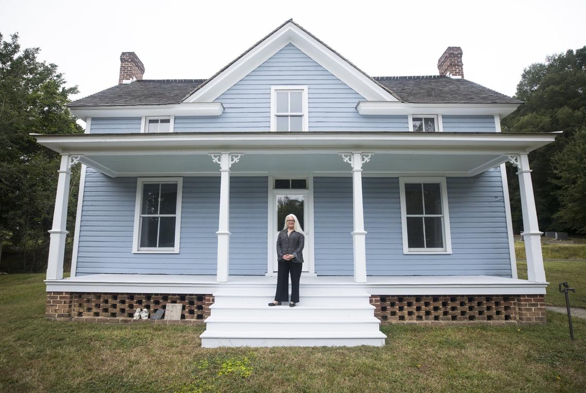 Barbara Lau, executive director of the Pauli Murray Center for History and Social Justice, poses for a portrait on the front steps of Murray’s childhood home in Durham, N.C. on Tuesday, Sept. 21, 2021. Lau is The News & Observer’s September 2021 Tar Heel of the Month.