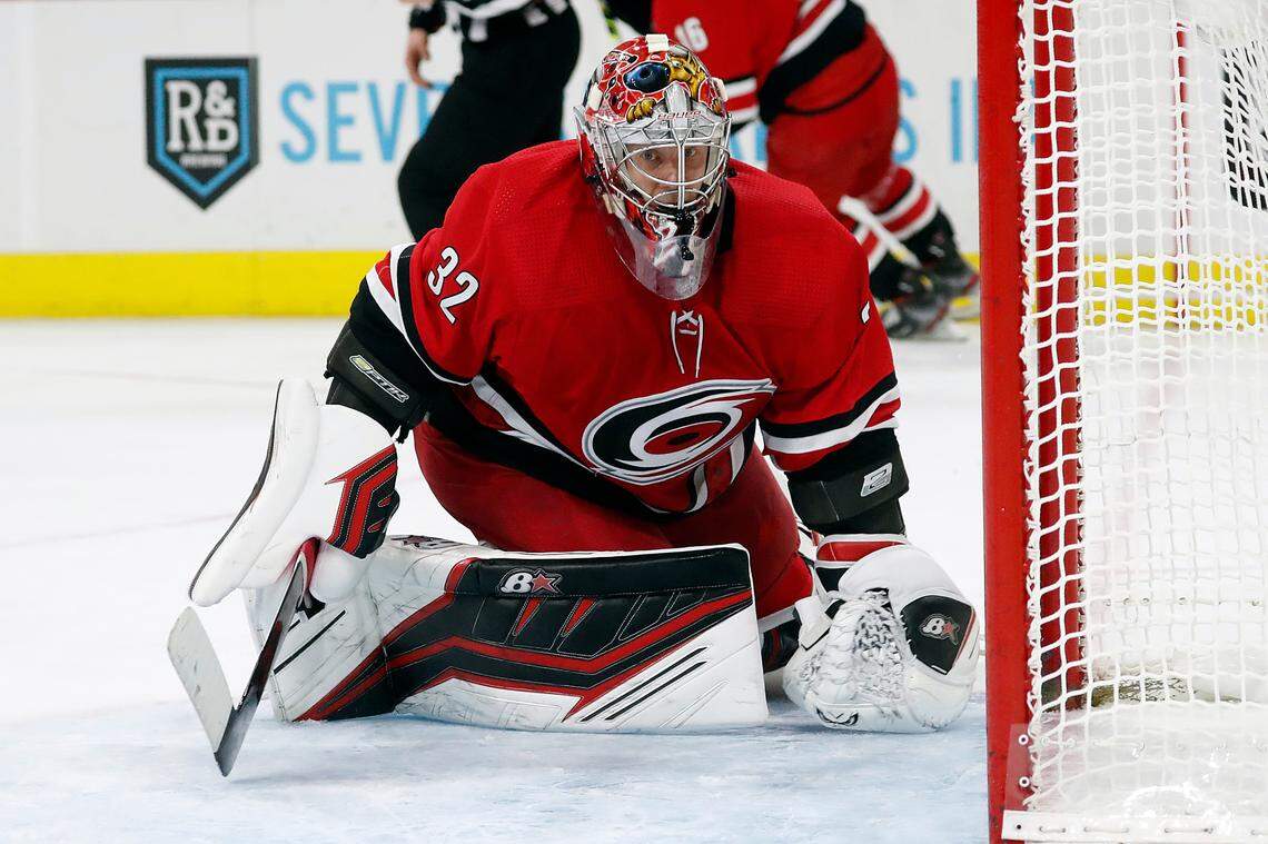 Carolina Hurricanes goaltender Antti Raanta (32) watches the puck against the Montreal Canadiens during the third period of an NHL hockey game in Raleigh, N.C., Thursday, Dec. 30, 2021. (AP Photo/Karl B DeBlaker)