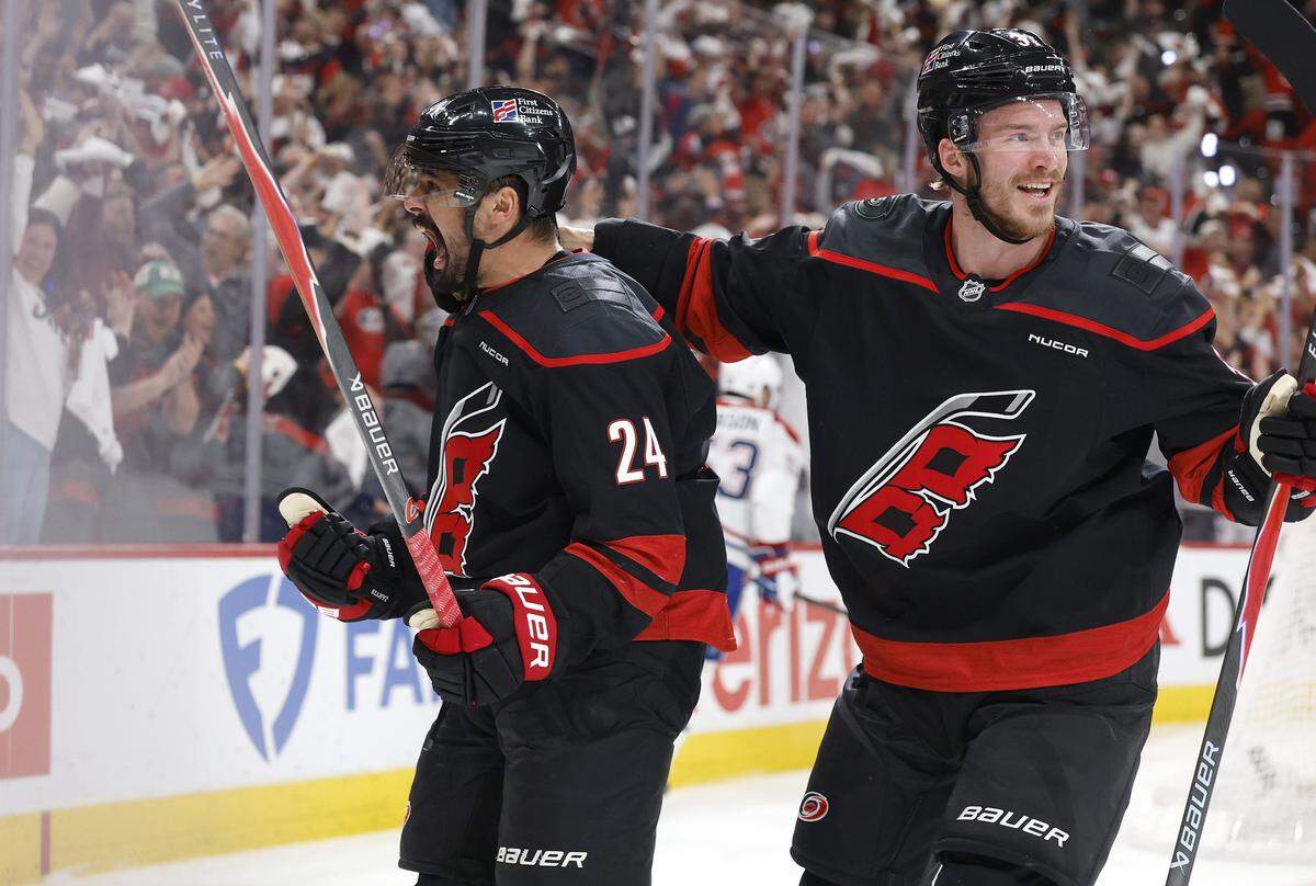 Carolina's Seth Jarvis (24) celebrates after scoring during the first period of the Hurricanes’ game against the Canadiens in game one of the Eastern Conference Finals at the Lenovo Center Thursday, May, 21, 2026. Carolina's Andrei Svechnikov (37) is to the right.