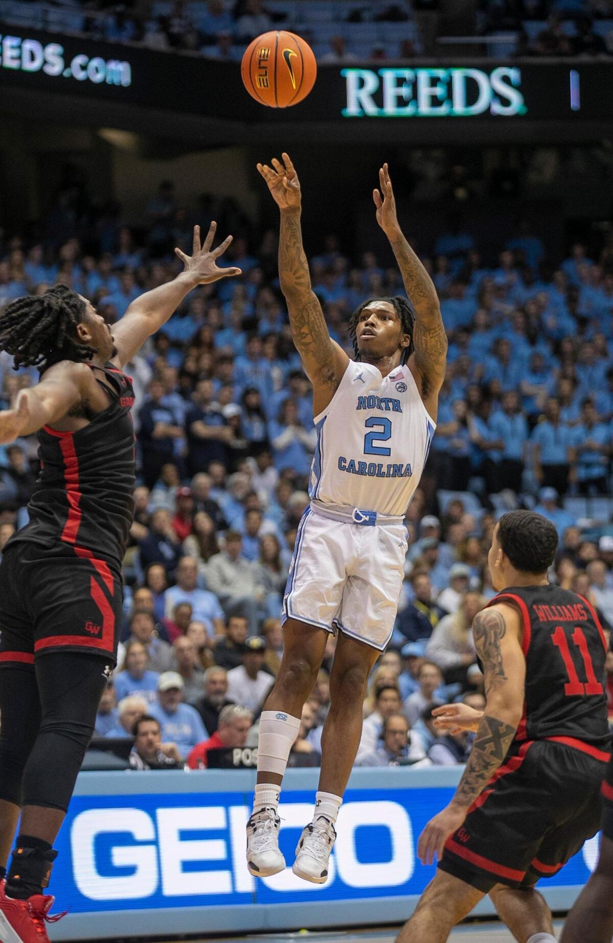 North Carolina’s Caleb Love (2) puts up a shot against Gardner-Webb’s Ademide Badmus (5) during the second half on Tuesday, November 15, 2022 at the Smith Center in Chapel Hill, N.C. Love scored 20 points in their 72-66 victory.