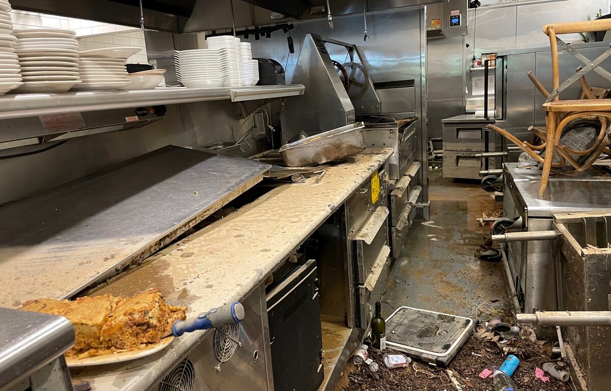 Restaurant employees left food sitting in the kitchen as they rushed to get customers to safety Sunday night at Kipos in Eastgate Shopping Center in Chapel Hill. The restaurant’s tables and chairs were left under floodwaters and warped by Monday morning.