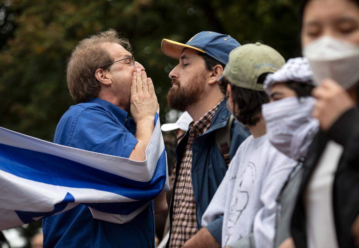 Protesters and counter-protesters interact during a rally in support of Palestinians at UNC-Chapel Hill on Thursday, Oct. 12, 2023. The rally was organized by the UNC chapter of Students for Justice in Palestine.