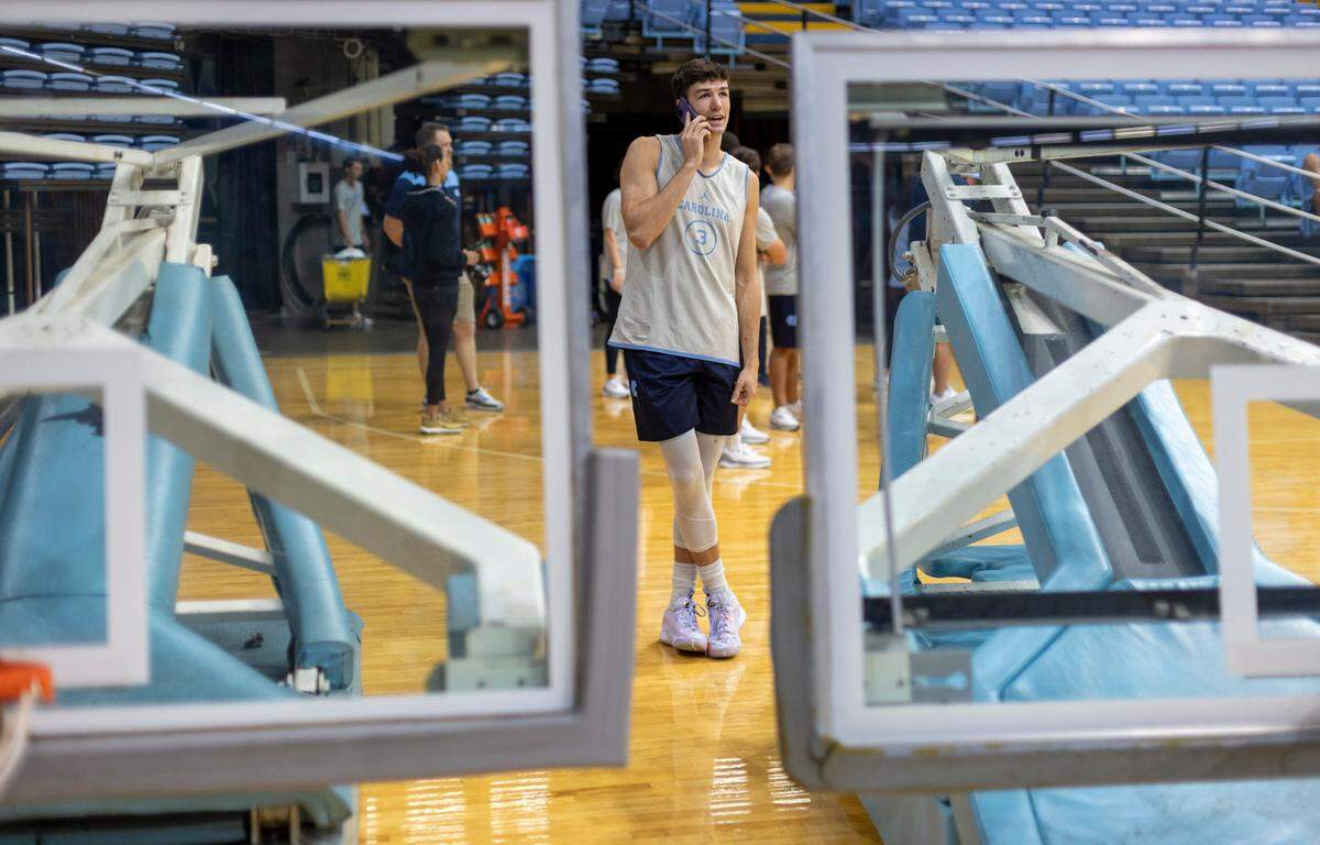 North Carolina’s Cormac Ryan (3) takes a phone call prior to the Tar Heels’ practice on Friday, October 6, 2023 at the Dean Smith Center in Chapel Hill, N.C.