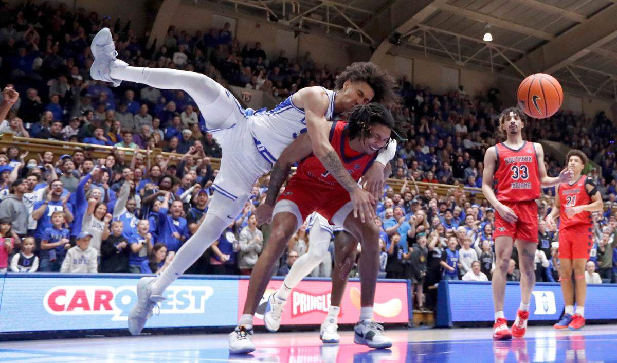Southern Indiana’s Javius Moore (1) fouls Duke’s Tyrese Proctor (5) after Proctor dunked the ball during Duke’s 80-62 victory over Southern Indiana at Cameron Indoor Stadium in Durham, N.C., Friday, Nov. 24, 2023. Moore and Proctor were both called for a technical.