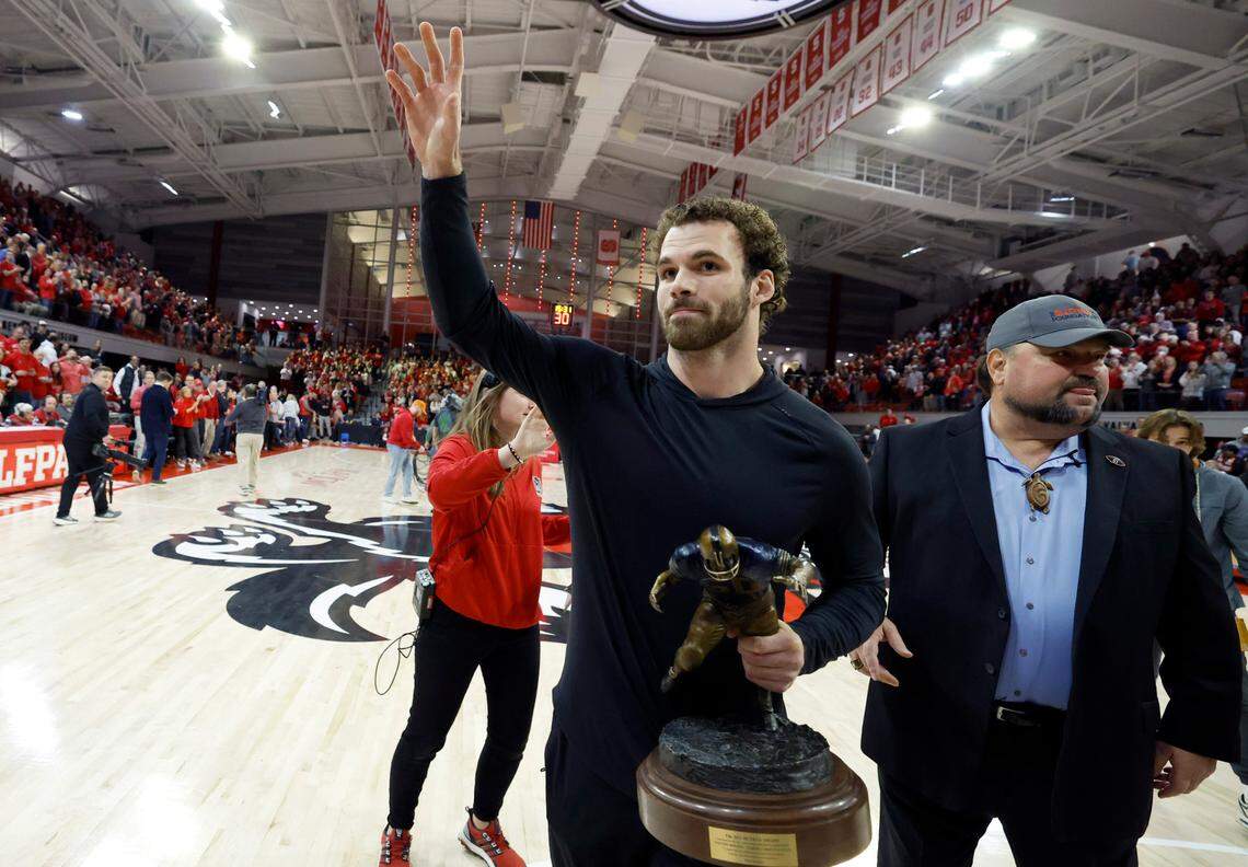 N.C. State linebacker Payton Wilson walks off the court after being awarded The Butkus Award during a timeout during N.C. State’s game against Maryland Eastern Shore at Reynolds Coliseum in Raleigh, N.C., Wednesday, Dec. 6, 2023.