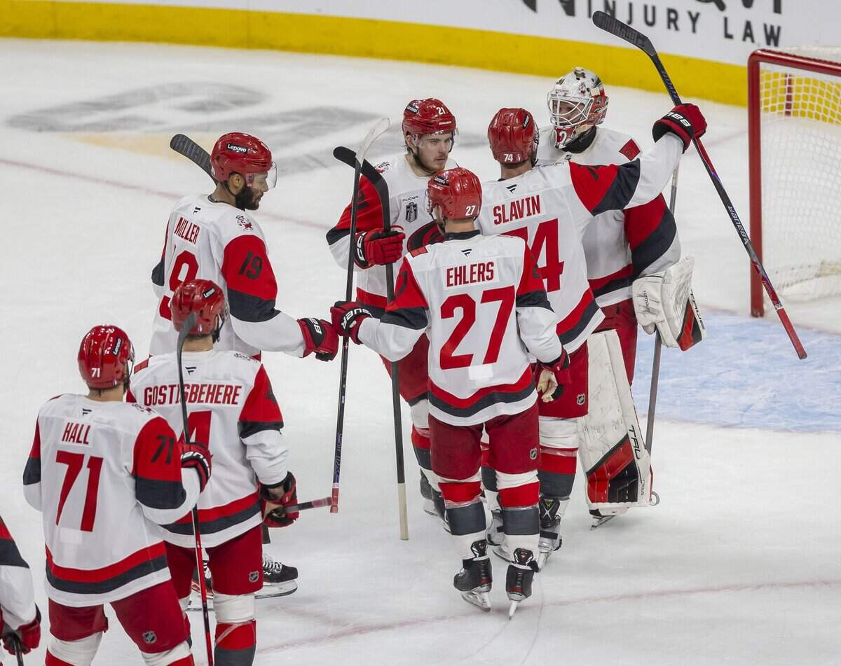 Carolina Hurricanes defenseman Jacoob Slavin (74) and his teammates line up congratulate goalie Brandon Bussi (32) after the Hurricanes’ 5-3 victory over Vegas in Game 4 of the Stanley Cup Final, on Tuesday, June 9, 2026 in Las Vegas, NV.