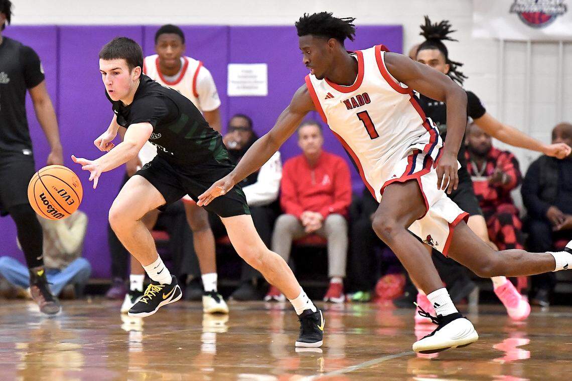 Greenfield's Johnny Winborne (2) makes the steal against Coronado's Munir Greig (1) during the second half. The Greenfield Knights and the Coronado Cougars (Nevada) met in the finals of the Day'Ron Sharpe bracket of the  John Wall Holiday Tournament in Raleigh, N.C. on December 30, 2025.