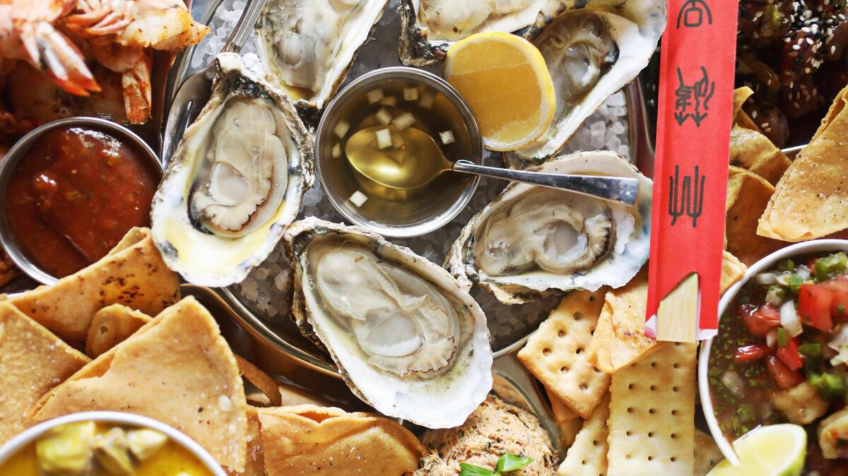 The Yacht Party at James Pharmacy is a seafood combination platter as lavish as its name: half a dozen oysters on the half shell, tuna poke, two kinds of ceviche (fish and shrimp), an addictive smoked bluefish dip, and Old Bay-dusted peel ÕnÕ eat shrimp.