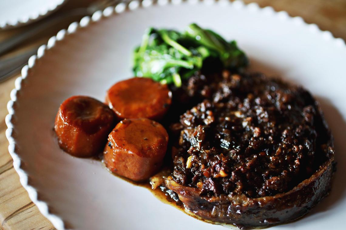 Cucciolo Osteria’s porchetta is a pork belly rolled around seasonal herbs and nuts and slow roasted.