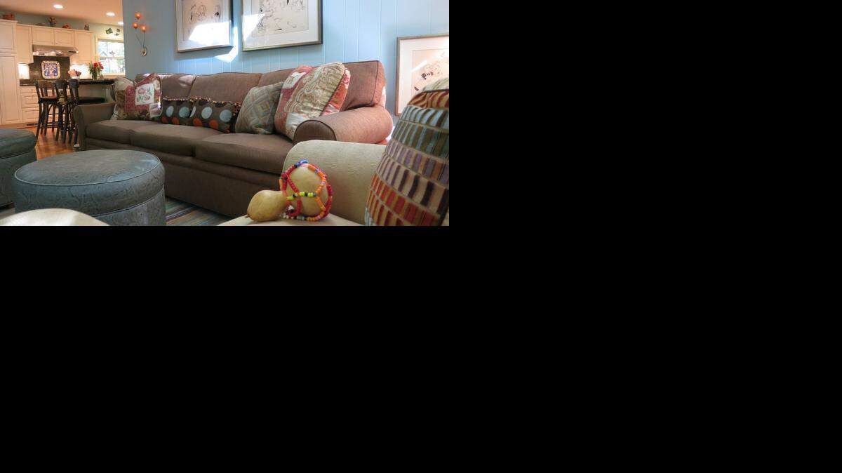 The small kitchen and adjacent family room do double duty as a preschool day care center and a family center in the evening.
