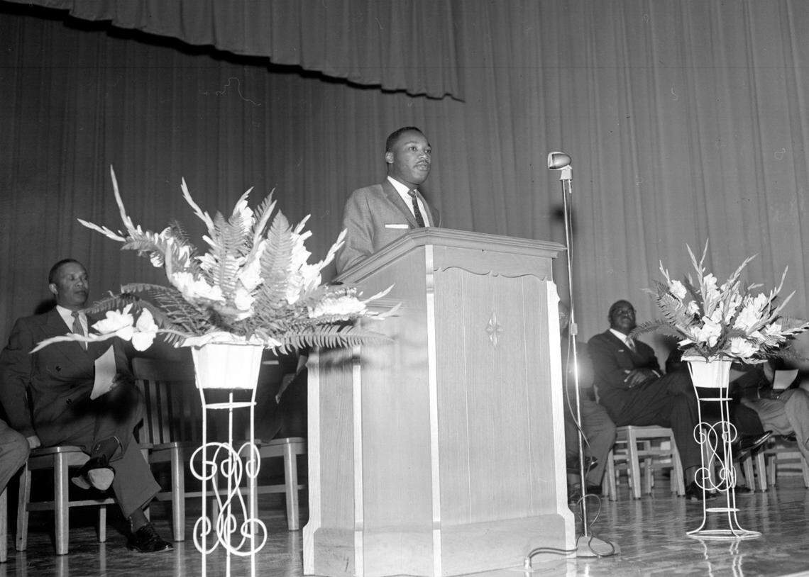 In one of his earlier visits to Durham, Dr. Martin Luther King, Jr., addresses the student body at Hillside High School, in this file photo from October 15, 1956.