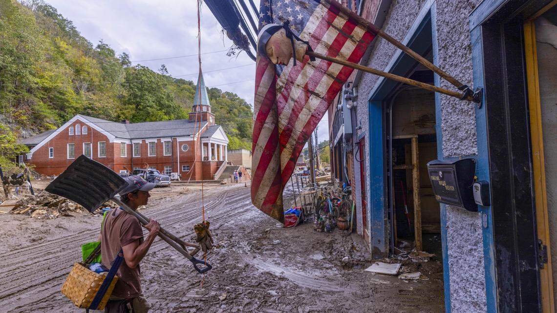Jen Dombrowski arrives in downtown Marshall to help a friend clean up her business on Tuesday, Oct. 1, 2024 after the French Broad River caused catastrophic flooding. The remnants of Hurricane Helene caused widespread flooding, downed trees, and power outages in western North Carolina.