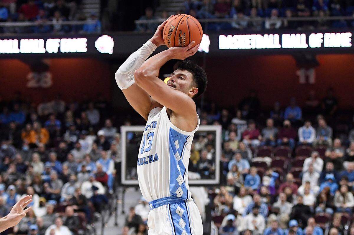 North Carolina’s Dawson Garcia (13) makes a 3-point basket in the first half of an NCAA college basketball game against Purdue, Saturday, Nov. 20, 2021.
