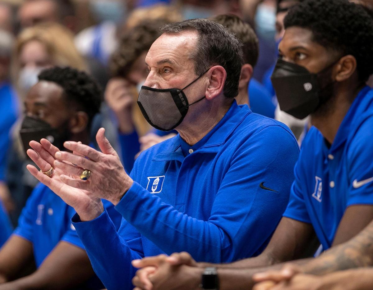 Duke coach Mike Krzyzewski and his assistants wear face coverings after assistant coach Nolan Smith missed the game against Elon due to the spread of the COVID-19 on Saturday, December 18, 2021 at Cameron Indoor Stadium in Durham, N.C.