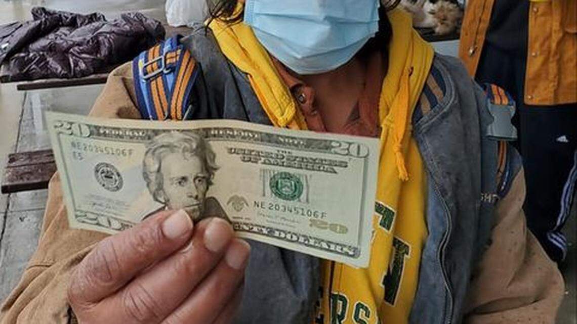 The Rev. Phil Brickle hands out $20 bills to Raleigh’s homeless, photographing each of them and posting to his Facebook page.