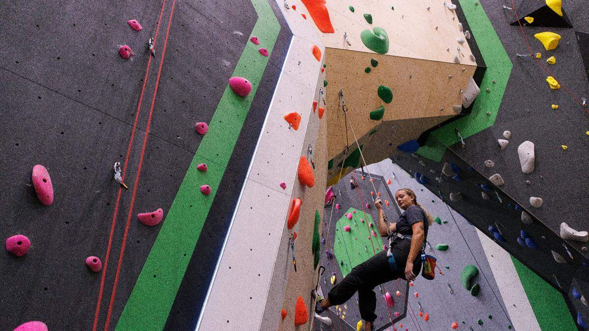 Bailey Rudd climbs at Triangle Rock Club’s new facility in Raleigh’s Salvage Yard on Friday, Sept. 27, 2024. The Salvage Yard site is the sixth location for the company and will be its biggest facility.