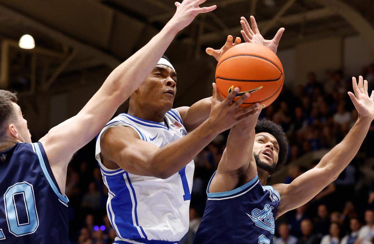 Duke’s Caleb Foster (1) drives past Maine’s Jaden Clayton (3) during the first half of Duke’s game against Maine at Cameron Indoor Stadium in Durham, N.C., Monday, Nov. 4, 2024.