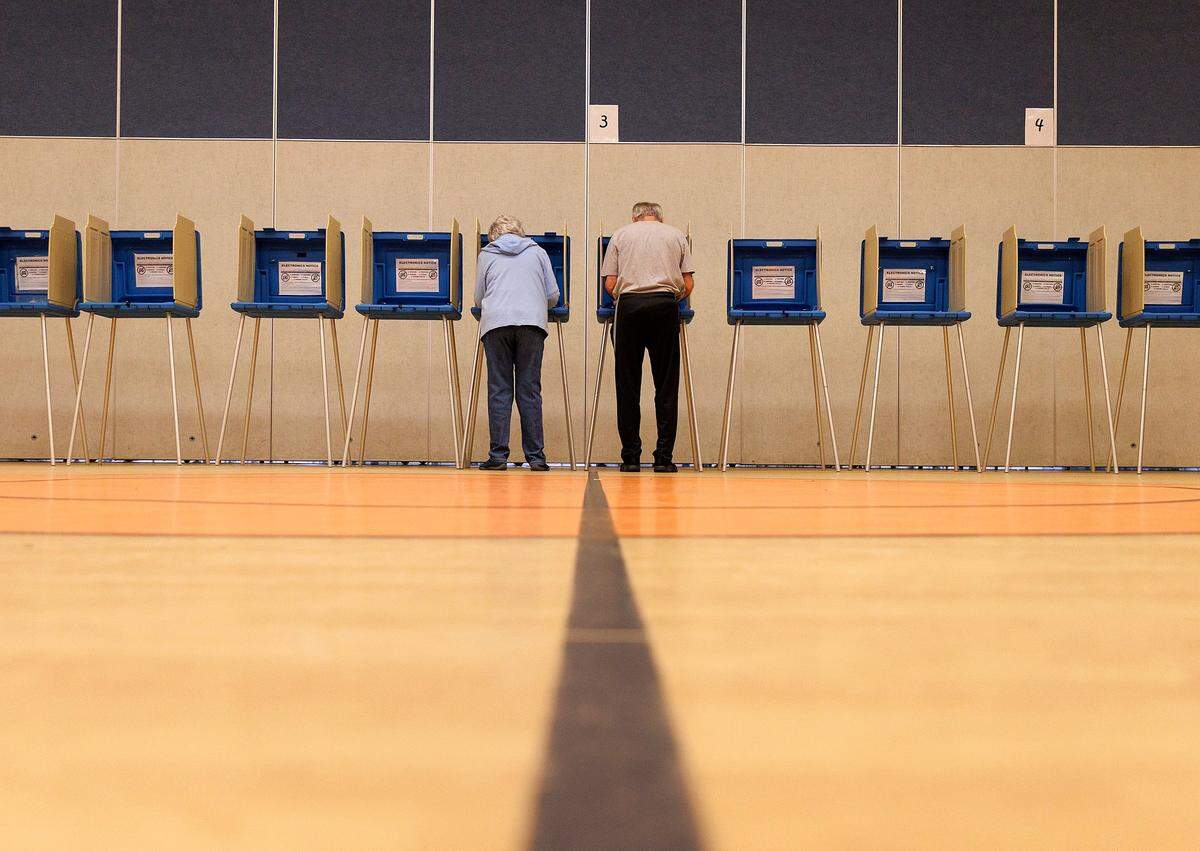 People cast their ballots at Aversboro Elementary School in Garner, N.C. on Tuesday, March 5, 2024.