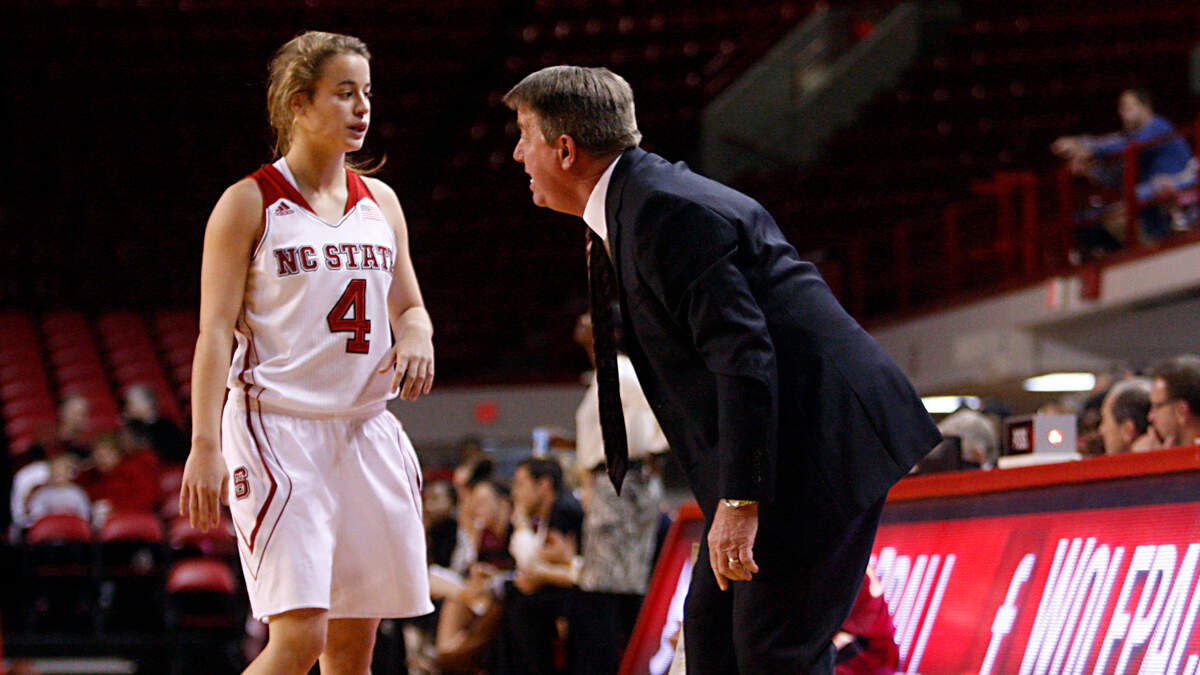 Women’s N.C. State Head Coach Wes Moore talks with freshman guard Ashley Williams during the game. N.C. State Wolfpack women with their fourth straight win at home over the Elon Phoenix and is off to its best start since the 2000-01 season. They played on Sunday, December 8, 2013 at Reynolds Coliseum in Raleigh, N.C. It also marks Head Coach Wes Moore’s 568th career win.