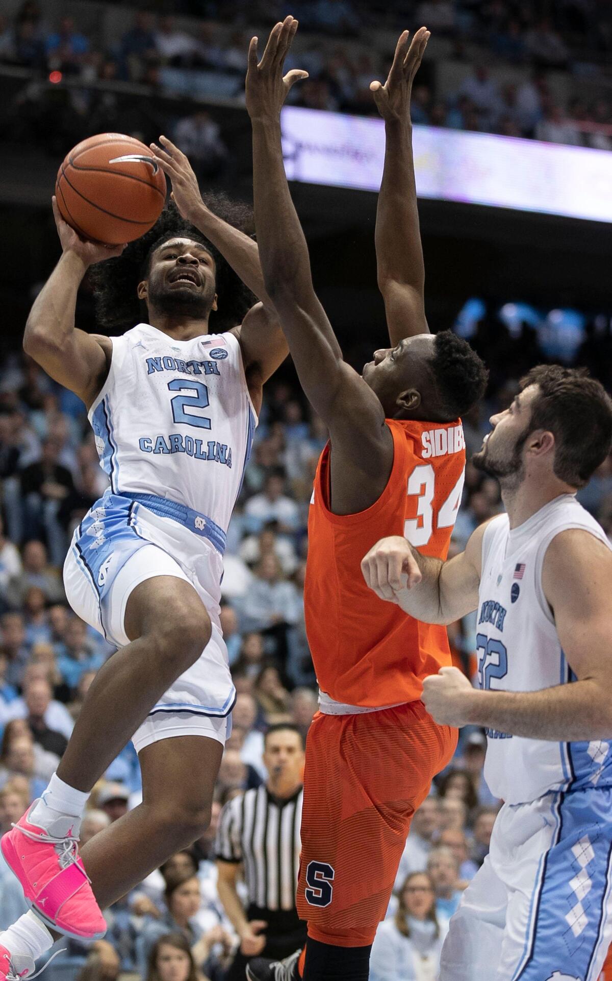 North Carolina’s Coby White (2) drives to the basket against Syracuse’s Bourama Sidbe (34)) during the first half on Tuesday, February 26, 2019 at the Smith Center in Chapel Hill, N.C.