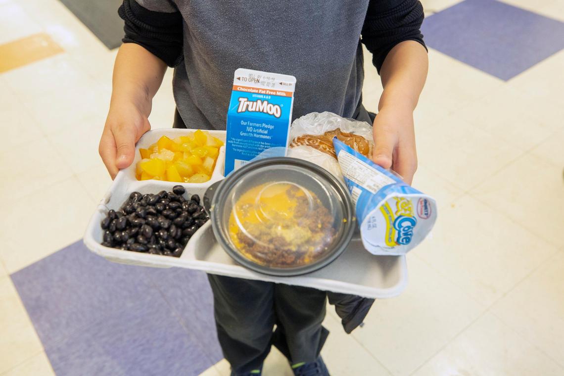 Nicolas Shahin holds his new fiber lunch tray in the cafeteria at Kingswood Elementary School in Cary, N.C., in this 2018 file photo.