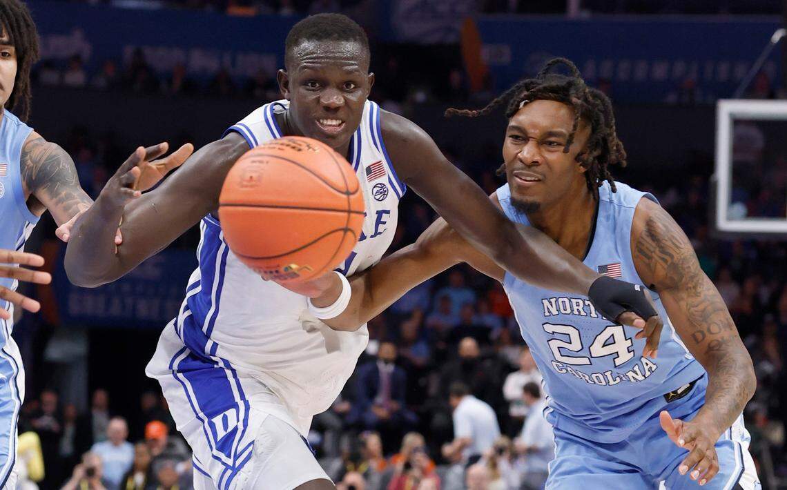 Duke’s Khaman Maluach (9) and North Carolina’s Jae’Lyn Withers (24) go after a rebound during the second half of Duke’s 74-71 victory over UNC in the semifinals of the 2025 ACC Men’s Basketball Tournament at the Spectrum Center in Charlotte, N.C., Friday, March 14, 2025.