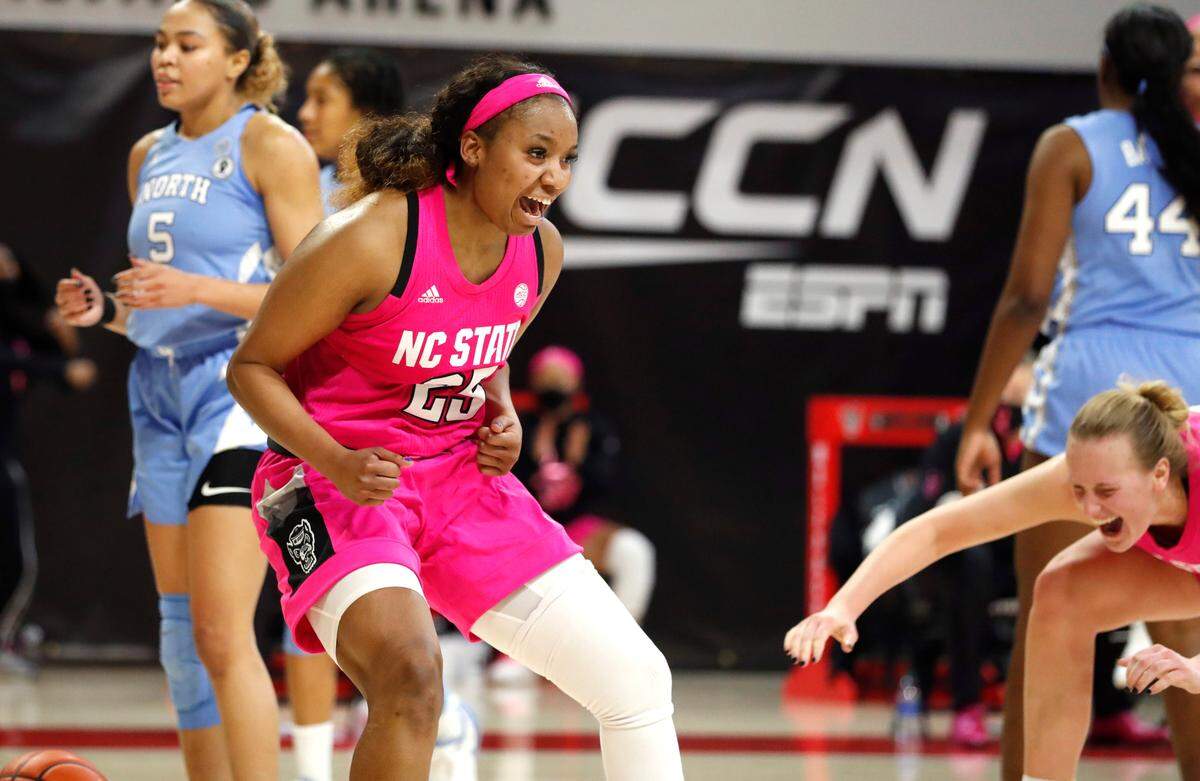 N.C. State’s Kayla Jones (25) celebrates after the basket went in after being fouled during the second half of N.C. State’s 82-63 victory over UNC in the annual Play4Kay game at Reynolds Coliseum in Raleigh, N.C., Sunday, February 21, 2021.