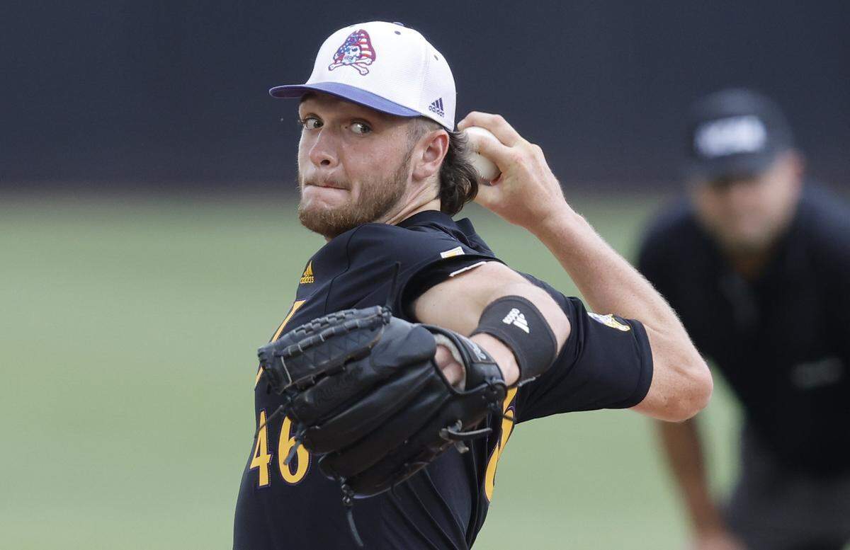 East Carolina’s Trey Yesavage (46) pitches in the first inning during ECUs game against Texas in the Greenville Super Regional at Clark-LeClair Stadium Sunday, June 12, 2022.