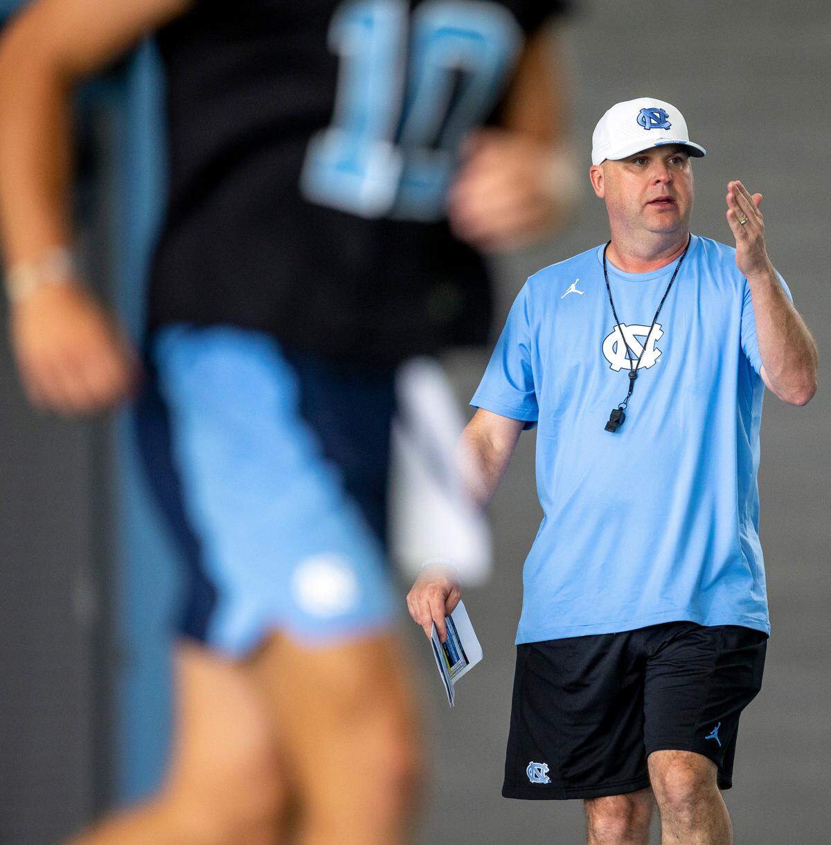 North Carolina offensive coordinator and quarterbacks coach Chip Lindsey works with Drake Maye (10) during the Tar Heels’ first practice of the season on Wednesday, August 2, 2023 in Chapel Hill, N.C.