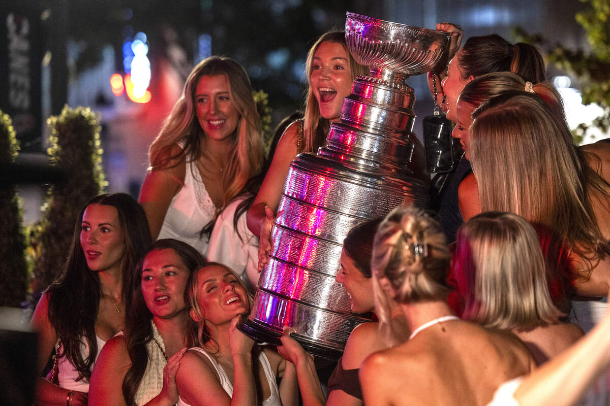 Carolina Hurricanes fans celebrate the team's Stanley Cup Final victory at Teets in Raleigh's Glenwood South district as the Stanley Cup, accompanied by Hurricanes players and staff, makes an appearance during a victory celebration Monday, June 15, 2026. The Hurricanes defeated the Vegas Golden Knights 4-2 in the Stanley Cup Final to win the franchise's second championship since 2006.