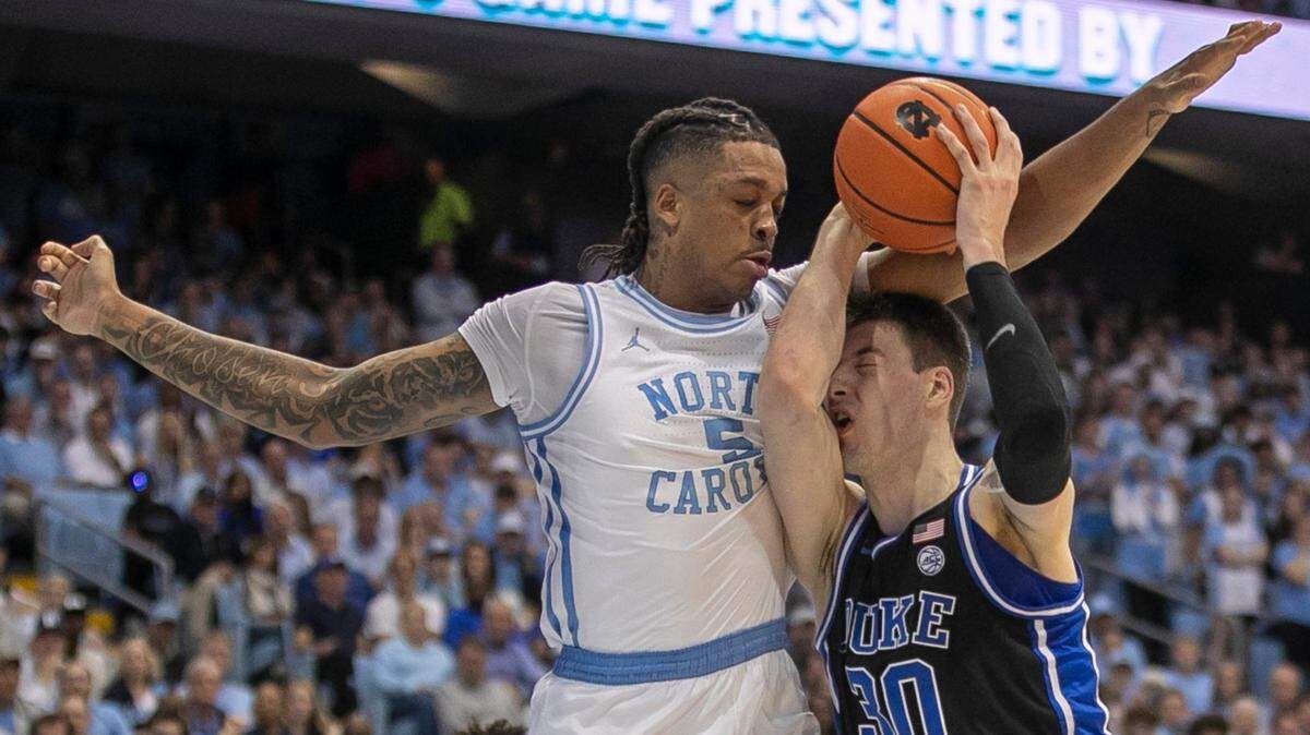 North Carolina’s Armando Bacot (5) defends Duke’s Kyle Filipowski (30) in the first half on Saturday, March 4, 2023 at the Smith Center in Chapel Hill, N.C.