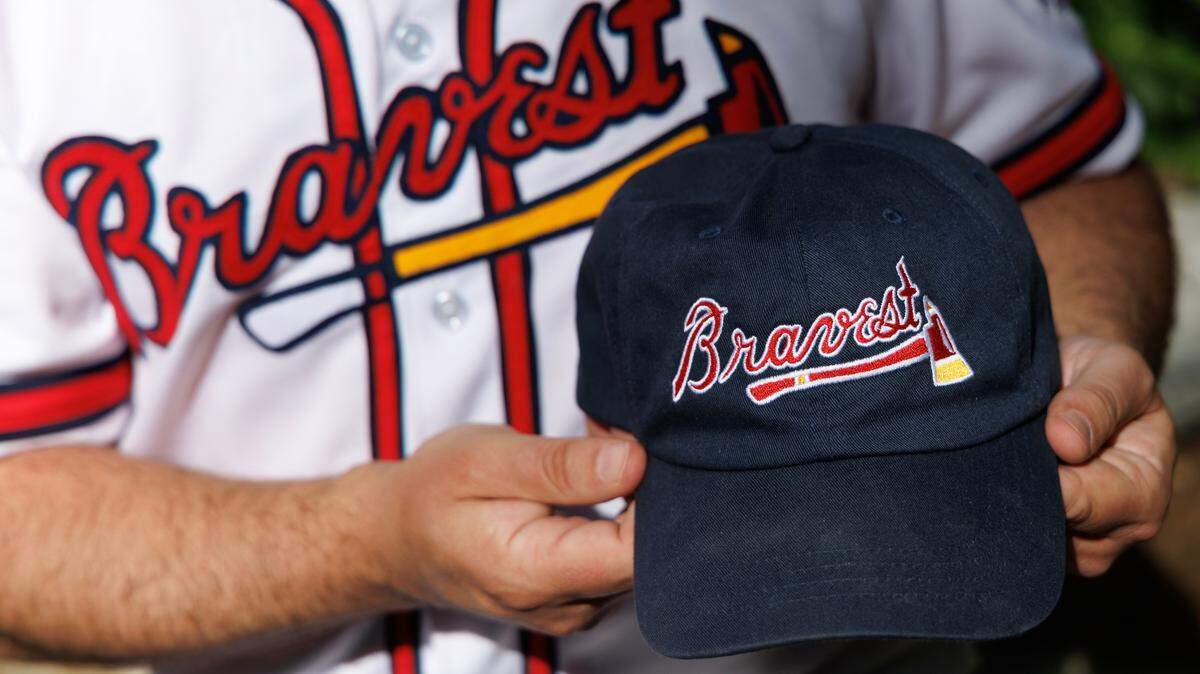 Chris Buccafusco, photographed in Durham on Wednesday, April 16, 2025, and his brother want to change the Atlanta Braves name to “Bravest” to respect Native Americans. The siblings created the fan club “Bravest ATL,” with an ax symbol that could represent first-responders.