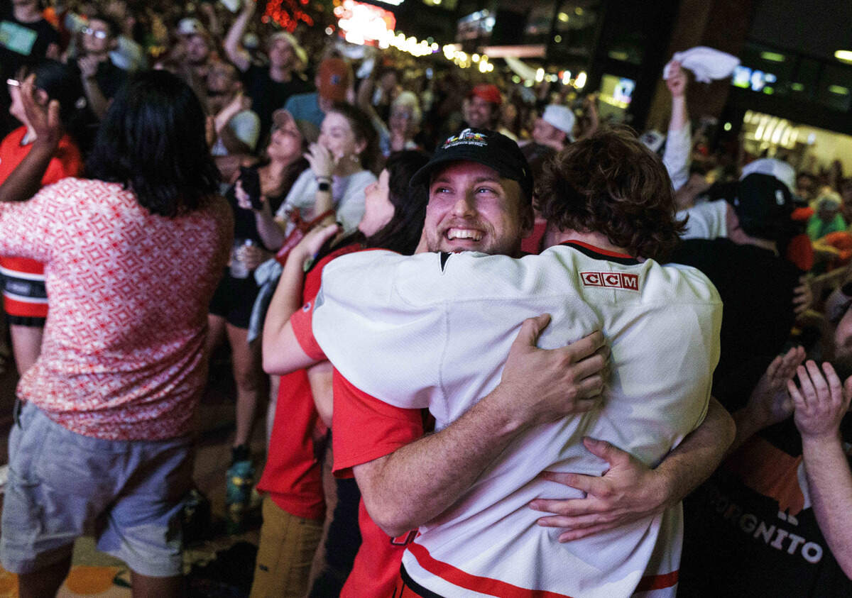 Fans embraced as the Carolina Hurricanes won their second Stanley Cup during a finals watch party at Smoky Hollow on June 14, 2026, in Raleigh, North Carolina. The Hurricanes last won the Stanley Cup in 2006.