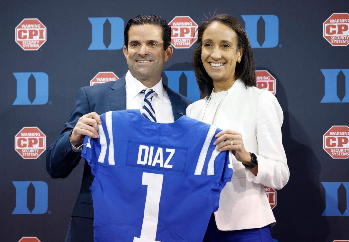 Duke athletics director Nina King poses with Manny Diaz after a press conference where Diaz was announced as Duke’s new head football coach Saturday, Dec. 9, 2023.