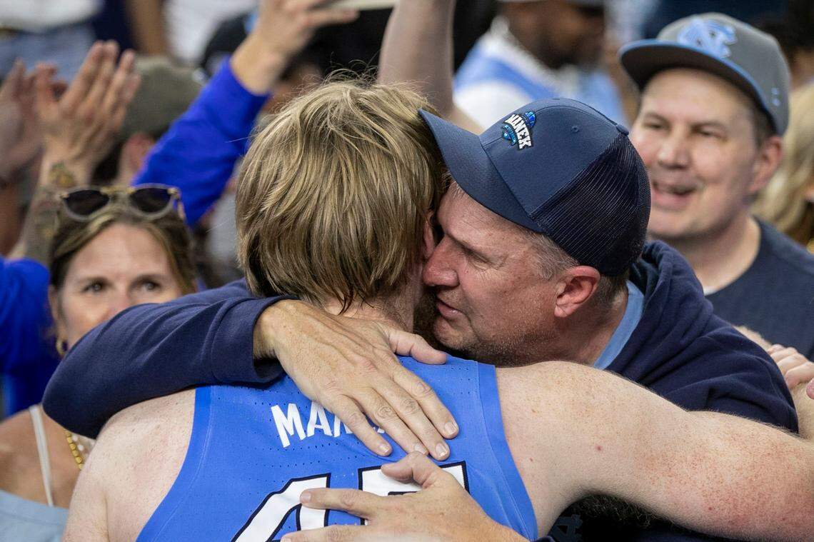 North Carolinas Brady Manek (45) embraces his father following the Tar Heels 81-77 victory over Duke during the NCAA Final Four semi-final on Saturday, April 2, 2022 at Caesars Superdome in New Orleans, La