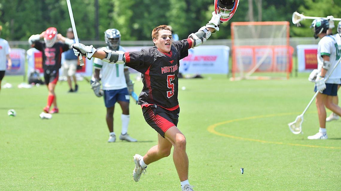 Middle Creek’s Camden Young (5) celebrates after Middle Creelk’s victory over Weddington. The Middle Creek Mustangs and the Weddington Warriors met in the NCHSAA 4A Men’s Lacrosse championships n Cary, N.C. on May 21, 2022