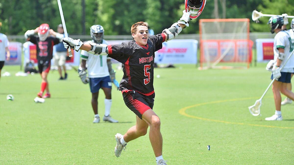 Middle Creek’s Camden Young (5) celebrates after Middle Creelk’s victory over Weddington. The Middle Creek Mustangs and the Weddington Warriors met in the NCHSAA 4A Men’s Lacrosse championships n Cary, N.C. on May 21, 2022