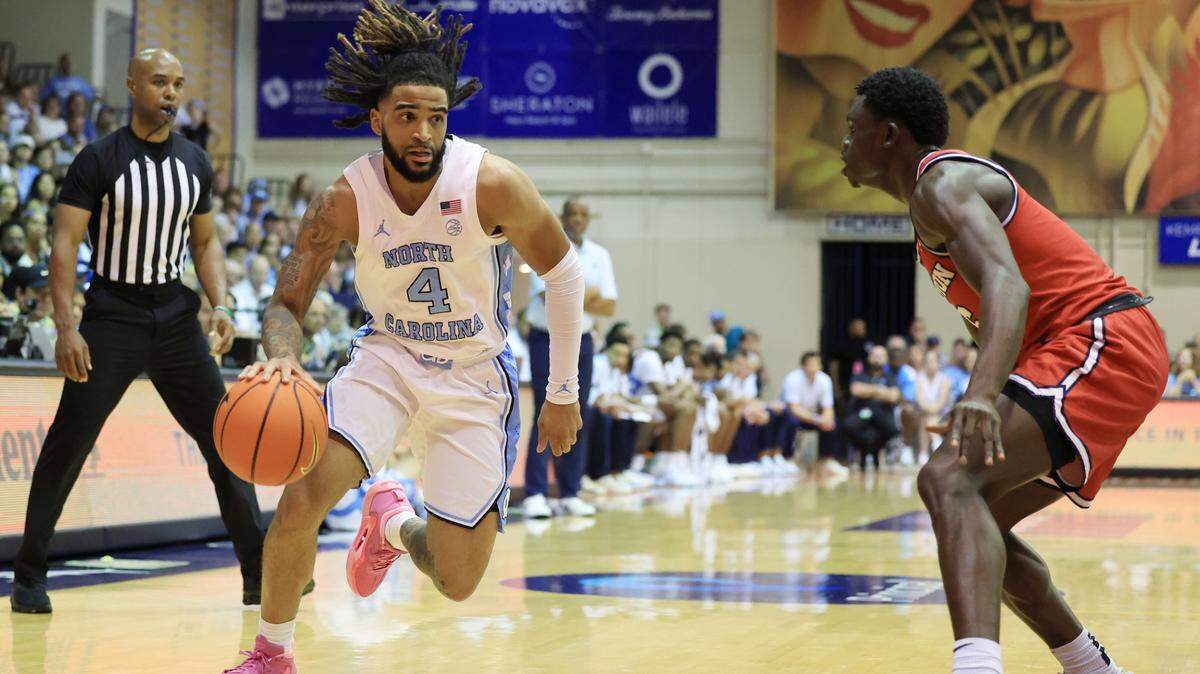 Nov 25, 2024; Lahaina, Hawaii, USA; North Carolina Tar Heels guard RJ Davis (4) dribbles against Dayton Flyers guard Enoch Cheeks (6) during the first half of an NCAA college basketball game at Lahaina Civic Center.