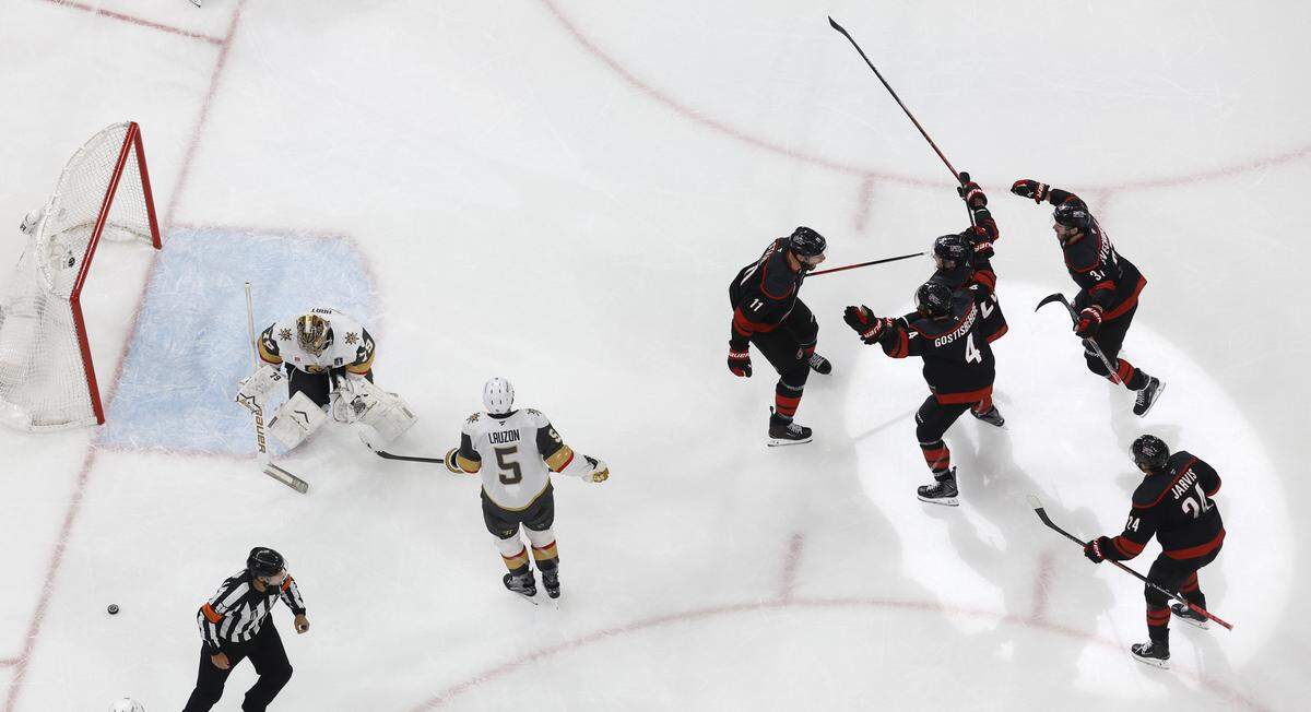 Carolina's Jordan Staal (11) celebrates with teammates after scoring in the third period during the Hurricanes’ 4-3 overtime victory over the Golden Knights in the second game of the Stanley Cup Final at the Lenovo Center in Raleigh, N.C., Thursday, June 4, 2026.