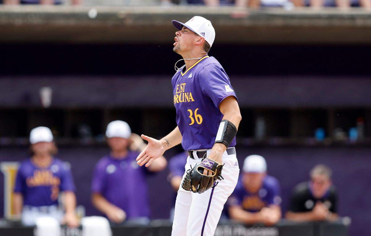 East Carolina’s Garrett Saylor (36) celebrates after striking out a Texas batter to end the inning during ECUs game against Texas in the Greenville Super Regional at Clark-LeClair Stadium Saturday, June 11, 2022.