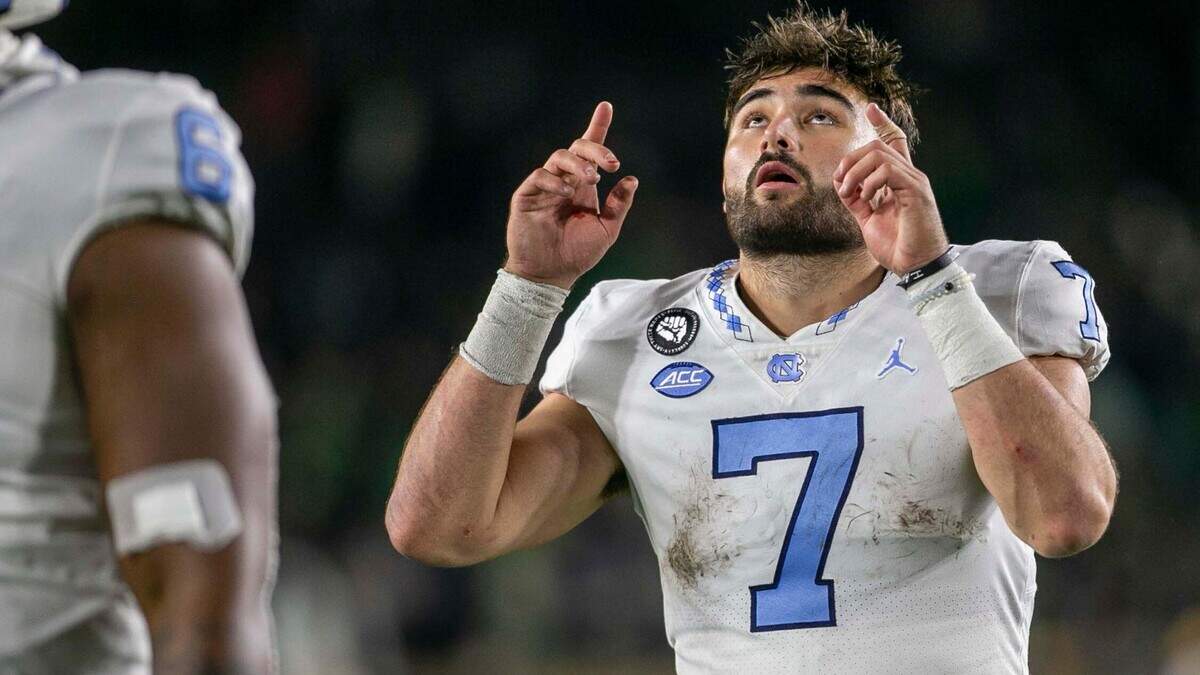 North Carolina quarterback Sam Howell (7) looks the heavens as he leaves the field following the Tar Heels’ 44-34 loss to Notre Dame on Saturday, October 30, 2021 in South Bend, Ind.